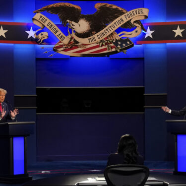 FILE - President Donald Trump and Democratic presidential candidate former Vice President Joe Biden participate in the final presidential debate at Belmont University, Oct. 22, 2020, in Nashville, Tenn. (AP Photo/Patrick Semansky)