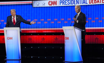 Republican presidential candidate former President Donald Trump, left, and President Joe Biden, right, speak simultaneously during a presidential debate hosted by CNN, Thursday, June 27, 2024, in Atlanta. (AP Photo/Gerald Herbert)