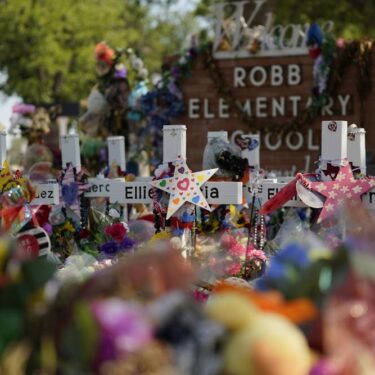 Crosses flowers and other memorabilia form