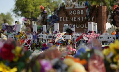 Crosses flowers and other memorabilia form