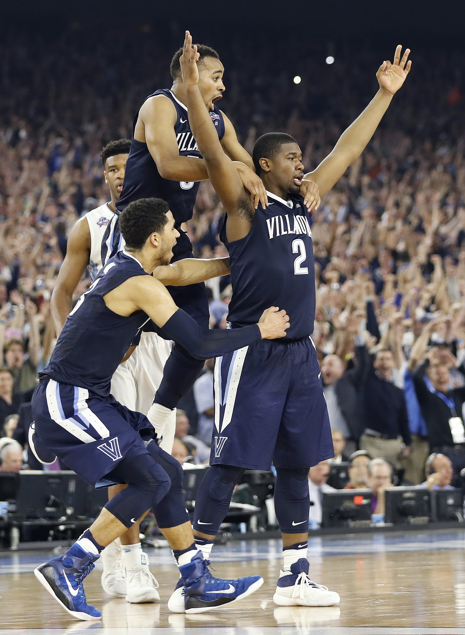 Villanova forward Kris Jenkins (2) celebrates with teammates after the NCAA Final Four tournament college basketball championship game against North Carolina in Houston, April 4, 2016. (AP Photo/Eric Gay)