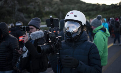 Renata Brito covering protests in the Spain-France border